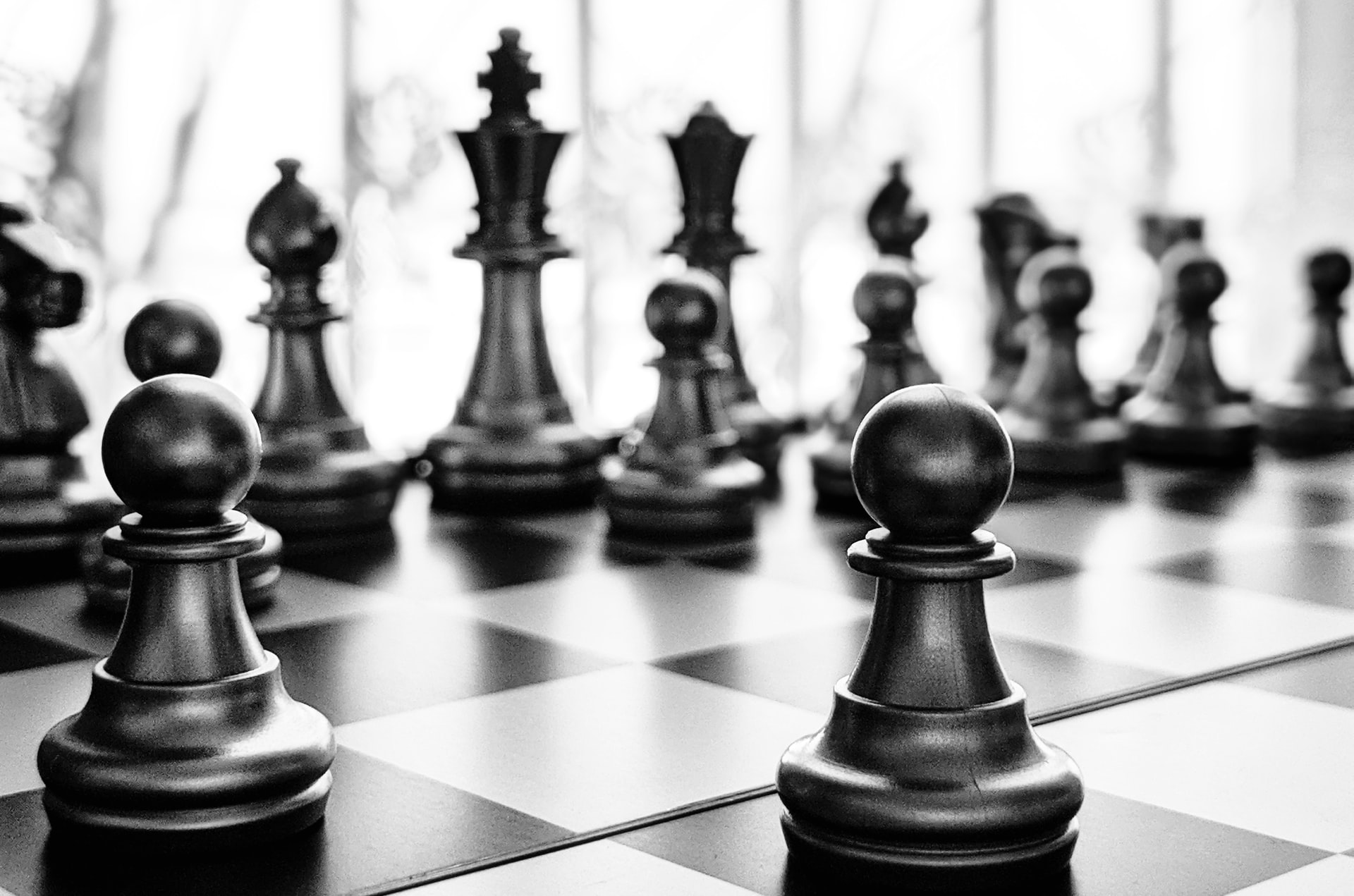 chess pieces (pawns, king and queen) illustrating senior leadership and tone from the top