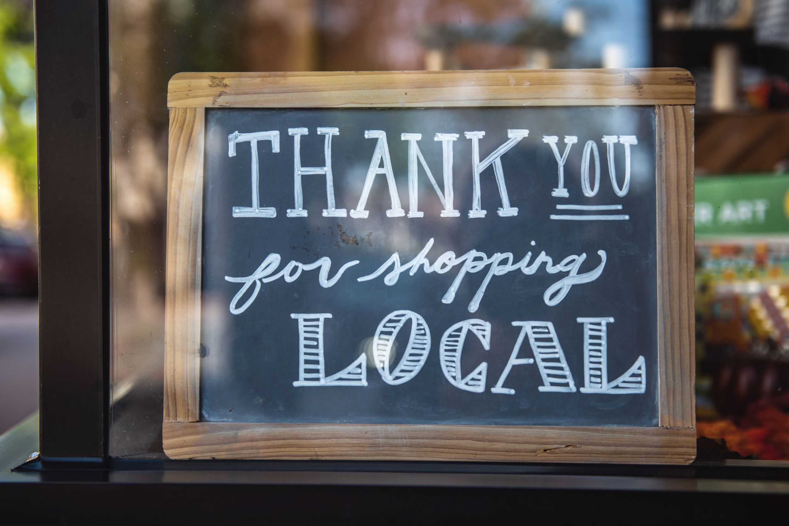 small business saturday - sign saying thank you for shopping local